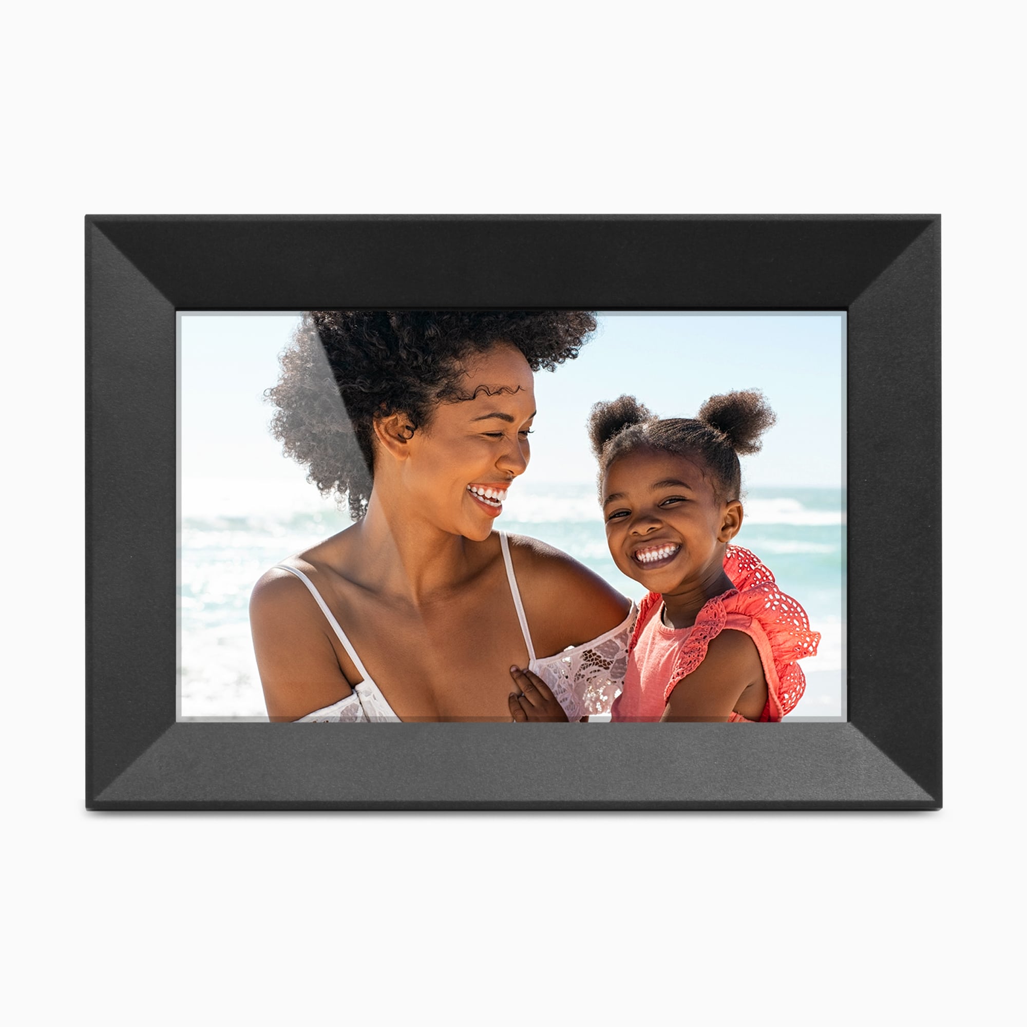 Digital photo frame displaying a picture of a woman and a young girl at the beach.